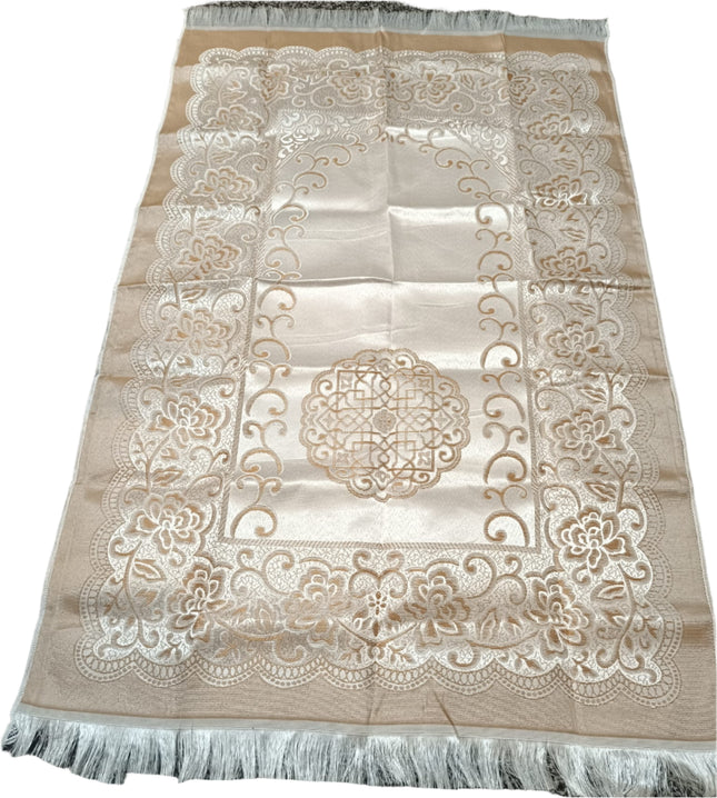 Beige fabric with intricate white embroidery on a textured surface